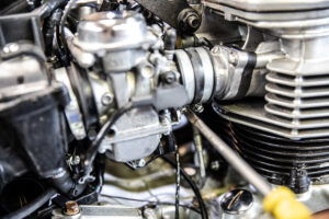 This shows loosening the band clamp on the carb side of the triumph speedmaster america motorcycle. 