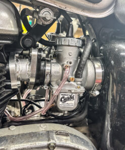 This picture shoes the left side of a Triumph T100 Bonneville 865 with Murray's new MIkuni Carburetor Kit installed.