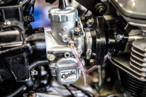 The left side of Murray's aftermarket performance carb kit for Triumph and America is now installed.