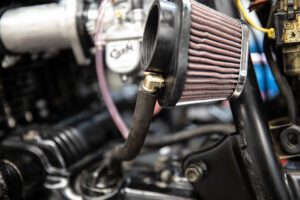 Attaching the crankcase vents to Murrays Carbs pod filters. 