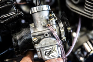 Loosely attaching the Mikuni spigots to the cylinder head side of the carburetors. 