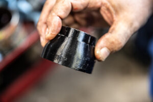 Showing the UP indicator marks on Murray's Triumph air box boot adapters. 