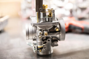 Adjusting the float height on a mikuni vm34 carburetor at Murray's Carbs. 