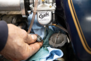 Draining fuel from a Mikuni VM carburetor float bowl. 