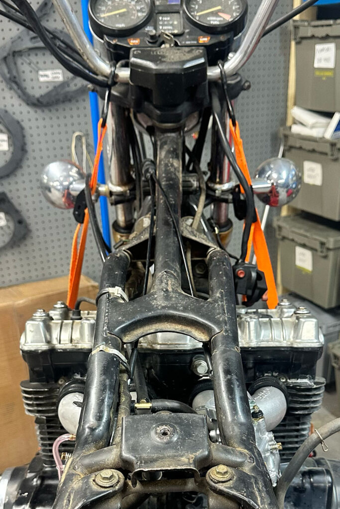 This picture shows how to route a Honda CB750 DOHC throttle cable. 